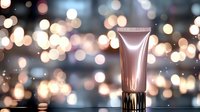 Luxurious cosmetic cream tube on reflective surface with magical bokeh lights background, elegant rose gold metallic packaging for beauty product advertising.