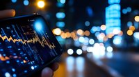 Mobile phone displaying financial market data chart with blurred city lights and bokeh background at night, modern trading and investment concept.