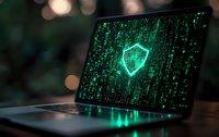 Laptop screen displaying digital security shield symbol with green matrix code background, representing cybersecurity and data protection.