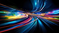 Abstract light trails creating dynamic motion effect with vibrant streaks of blue, red, yellow and green colors against dark background, suggesting high-speed movement and technology.