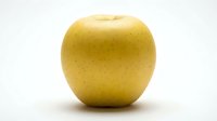 Fresh yellow apple isolated on white background, ready for food and nutrition design projects.