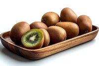Fresh ripe kiwi fruits in wooden serving plate on white background, one cut in half showing bright green flesh and black seeds, healthy food concept.