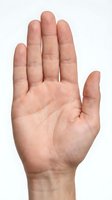 Open palm hand gesture showing stop sign isolated on white background for communication and body language concepts.