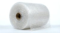 Rolled bubble wrap with cardboard tube core on white background, used for protective packaging, shipping, and storage of fragile items.
