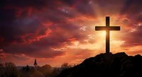 Christian cross silhouette on hill against dramatic sunset sky with orange and red clouds for religious worship and spiritual faith concepts.