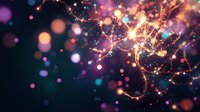 Magical glowing sparkles and light trails with colorful bokeh effect on dark background create dreamy atmospheric celebration mood. Great for festive designs.