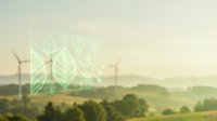 Sustainable energy concept with green leaf pattern overlay on renewable wind turbines in rural landscape at sunrise.