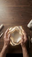 Baker kneading dough on wooden surface with rolling pin, napkin and utensils nearby for baking and cooking projects.
