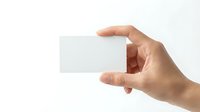 Hand holding blank white business card mockup on clean background for branding and corporate identity design projects.