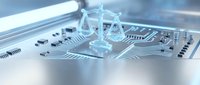 Digital justice scales hologram on circuit board representing legal technology, AI law, cyber jurisprudence and futuristic legal system innovation.