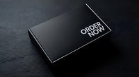 Sleek black gift box with Order Now text on dark stone background, perfect for e-commerce, retail branding, and packaging mockup concepts.