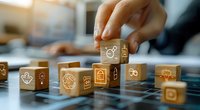 Digital transformation concept illustrated with wooden cubes featuring glowing technology icons, perfect for business strategy and innovation presentations in modern workplace setting.