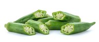 Fresh green okra pods whole and sliced showing seeds inside isolated on white background for healthy cooking and vegetable design projects.