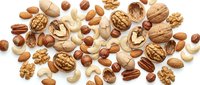 Mixed nuts collection with walnuts, almonds, hazelnuts, pecans and cashews scattered on white background for healthy snacking and cooking recipes.