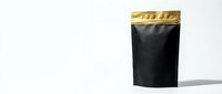 Black coffee pouch with golden top seal isolated on white background for product packaging design and branding mockup presentations.