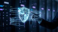 Digital cybersecurity shield hologram with glowing blue light effects and data streams for technology protection and network security concepts.