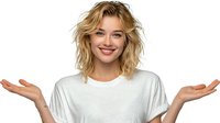 Young woman with blonde wavy hair smiling with open arms gesture against white background, isolated for commercial design use.