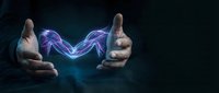 Two hands creating magical purple energy lightning between palms on dark background for fantasy design projects and digital art concepts.