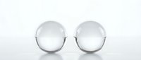 Two clear crystal spheres on white background for meditation, decoration and spiritual practices. Transparent glass orbs isolated for design use.