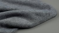 Soft gray knitted fabric with natural folds and texture, cotton or wool blend material for clothing design, textile background for fashion projects.