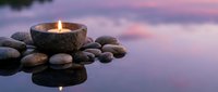 Zen spa candle floating on calm water with smooth stones creating peaceful meditation atmosphere for wellness and relaxation rituals.