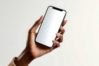 African American woman hand holding modern smartphone with blank white screen mockup for app presentation and mobile technology display.