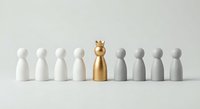 Golden pawn figure with crown stands out among white and gray wooden pieces on neutral background representing leadership and uniqueness in business.