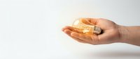 Hand holding glowing light bulb symbolizing innovation, creativity and bright ideas for business solutions and inspiration concepts.