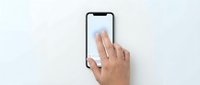 Hand of a person with medium skin tone touching a smartphone screen with notch display on white background, suitable for mobile app development, technology tutorials, and user interface design.