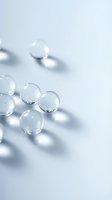 Transparent glass spheres with soft shadows on white background, suitable for skincare, cosmetics, pharmaceutical and scientific design projects.
