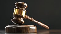 Wooden judge gavel and sound block on dark background with dramatic lighting, symbolizing law, justice, and legal proceedings in courtroom setting.