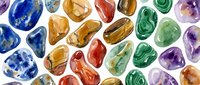 Polished gemstones and crystals in vibrant colors including blue, green, purple, and amber arranged on white background for jewelry design, mineral collection displays, and wellness product packaging.