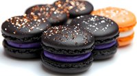 Colorful French macarons with chocolate shells and purple filling decorated with golden sprinkles on white background for bakery menu design.