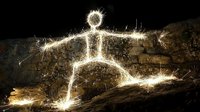 Glowing light painting of stick figure person sitting on dark stone wall at night, created with long exposure sparkler photography technique against black background.