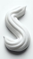 White creamy swirl texture with smooth flowing curves and soft shadows, isolated on light background for design, cosmetics, skincare, and beauty product packaging applications.