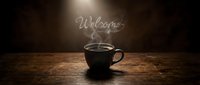 Hot coffee cup with steam forming the word Welcome on dark moody background, wooden table, warm light for cafe or hospitality design.
