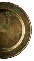Antique brass bowl with green patina and concentric circular texture, overhead view on white background for design and decoration projects.