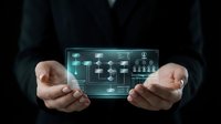 Business professional displaying holographic digital interface with network connectivity icons and data visualization elements for modern technology presentations.