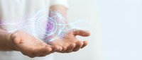 Hands holding glowing digital holographic sphere with network connections and data visualization effects for technology and innovation concepts.