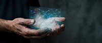 Male hands holding glowing digital network interface with data connections and technology visualization for business innovation and digital transformation concepts.