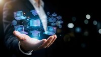 Digital technology icons floating above businessman's hand displaying connected devices, data networks, and cloud computing symbols for business innovation and digital transformation concepts.