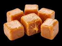 Caramel candy cubes isolated on transparent background, ready for t-shirt designs, clipart, stickers, print-on-demand products, and sublimation projects.