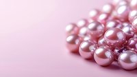 Pink lustrous pearls scattered on soft pink background with selective focus creating dreamy romantic mood, suitable for jewelry and fashion designs.