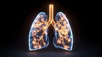 Glowing human lungs with energy light effect on black background, anatomical visualization showing bronchi and pulmonary structure in luminous detail.