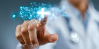 Medical professional touching glowing digital cross with network connections on virtual interface, representing modern healthcare technology and innovation.