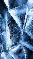 Macro shot of cracked ice surface with geometric patterns in cool blue tones showing natural crystalline structure and frost textures. Suitable for winter designs.