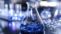 Laboratory flask with blue chemical solution bubbling in modern research facility for scientific experiments and pharmaceutical development.