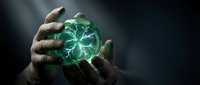 Hands holding glowing green energy sphere with electric lightning effects against dark background for fantasy and supernatural concepts.