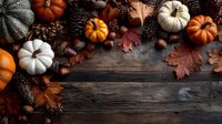 Autumn harvest border with colorful pumpkins, pine cones, acorns, and fallen leaves on rustic wooden background, creating seasonal frame with copy space.