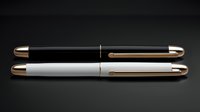 Elegant black and white fountain pens with gold accents on dark background. Luxury writing instruments displayed in minimalist composition for stationery design.